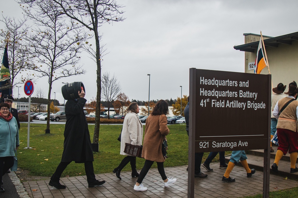 Soldiers with 41st FAB HHB BDE celebrate their new partnership with representatives from the community of Flossenbürg at Grafenwoehr, Germany