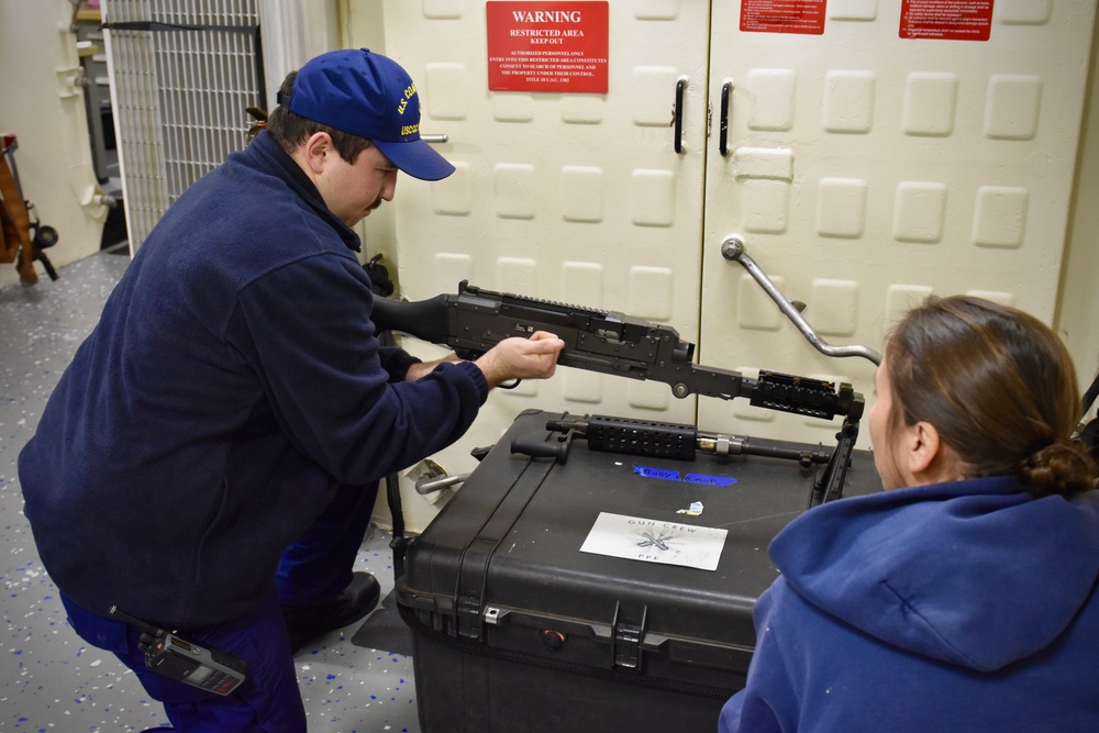 USCGC Hamilton personnel conduct small arms and minor mount performance qualification system training while operating in the Baltic Sea