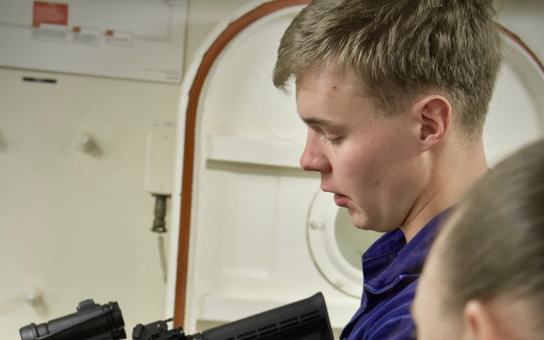 USCGC Hamilton personnel conduct small arms and minor mount performance qualification system training while operating in the Baltic Sea