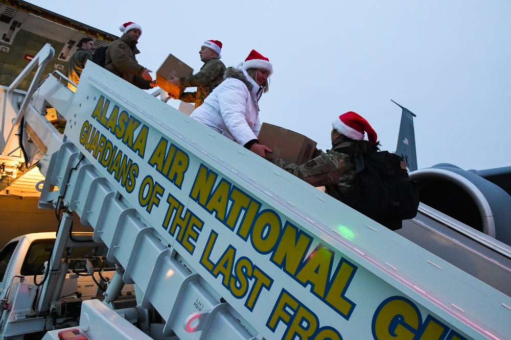 Alaska Air and Army National Guard serve as elves and deliver Holiday packages to Minto