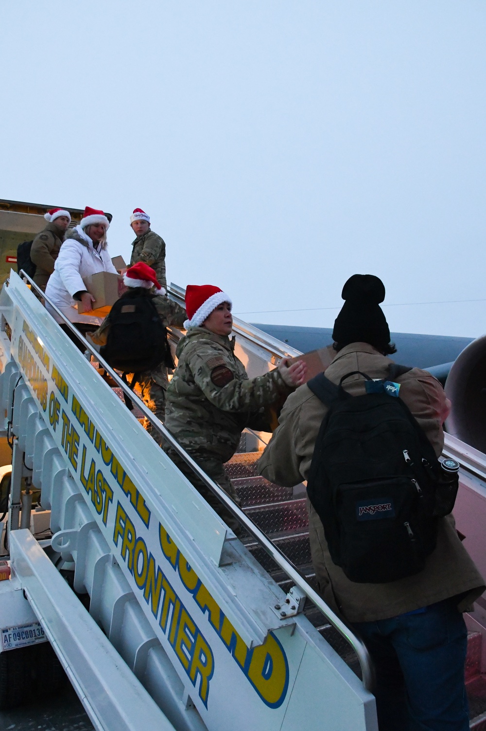 Alaska Air and Army National Guardsmen serve as elves and deliver Holiday packages to Minto