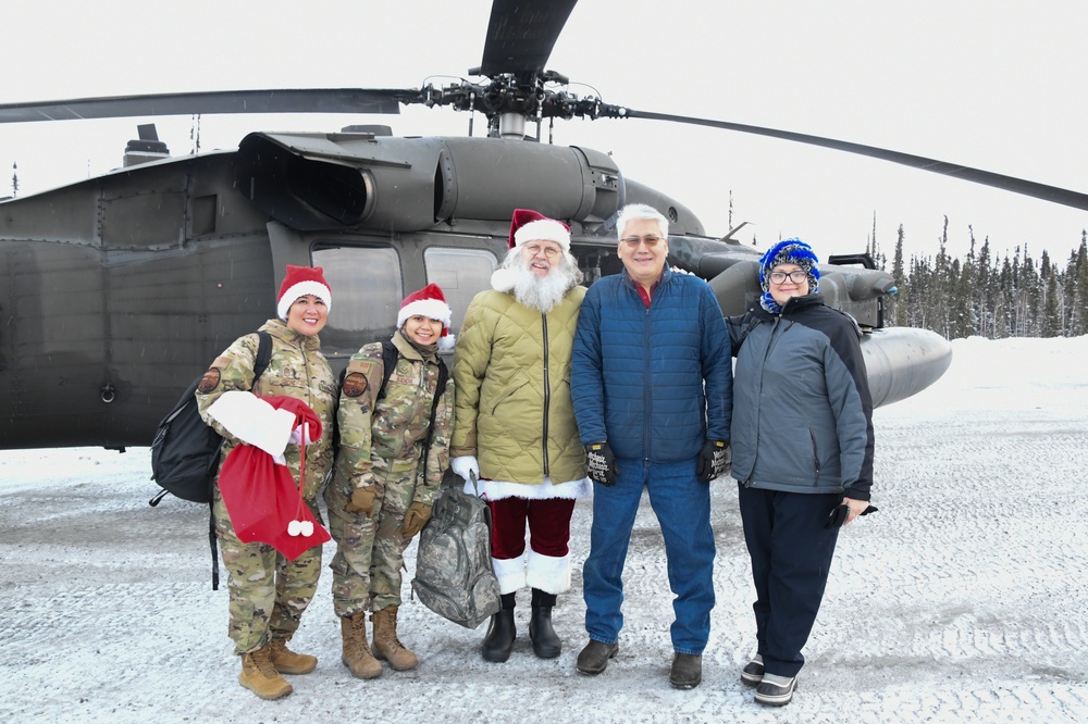 Alaska Air and Army National Guardsmen serve as elves and deliver Holiday packages to Minto