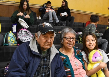 Alaska Air and Army National Guardsmen serve as elves and deliver Holiday packages to Minto