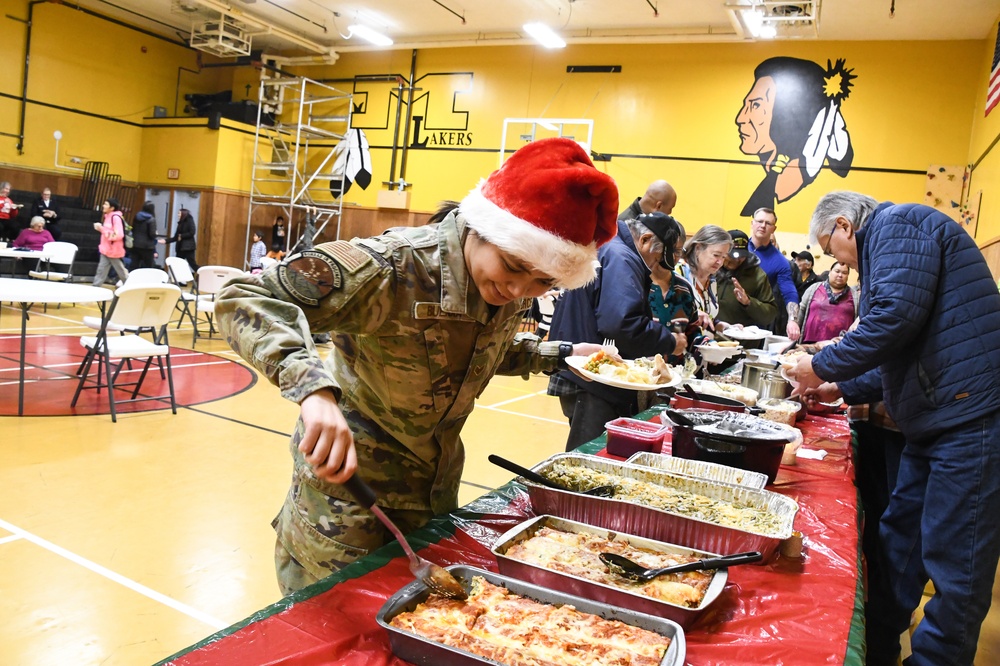 Alaska Air and Army National Guardsmen serve as elves and deliver Holiday packages to Minto