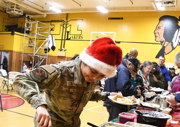 Alaska Air and Army National Guardsmen serve as elves and deliver Holiday packages to Minto