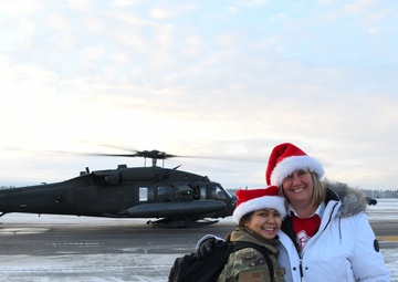 Alaska Air and Army National Guardsmen serve as elves and deliver Holiday packages to Minto