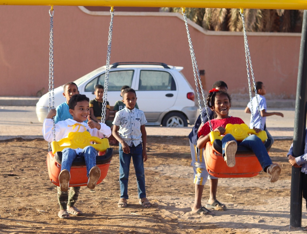 Children enjoy the new playground in Sedamous, Libya.