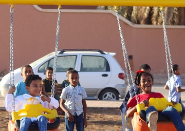 Children enjoy the new playground in Sedamous, Libya.