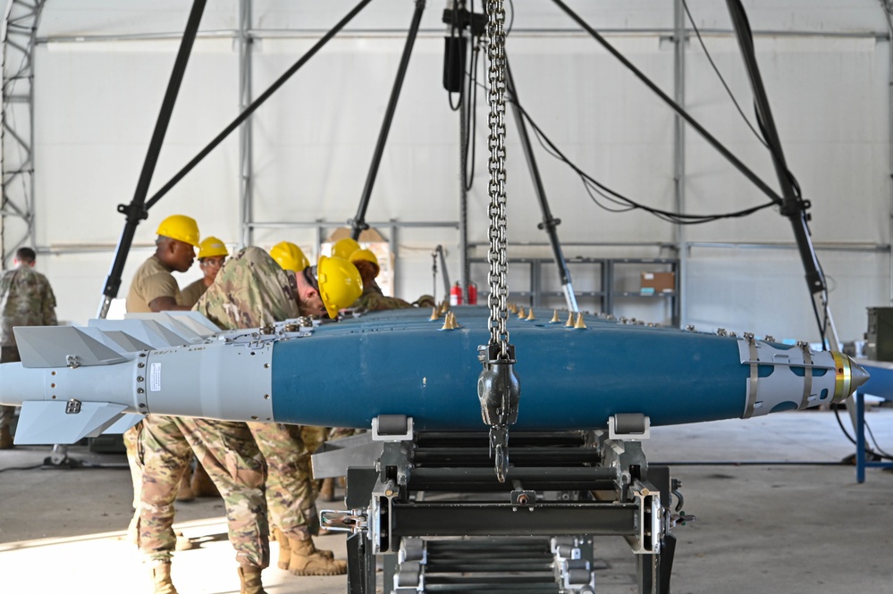113th AMXS train by building GBU-38s