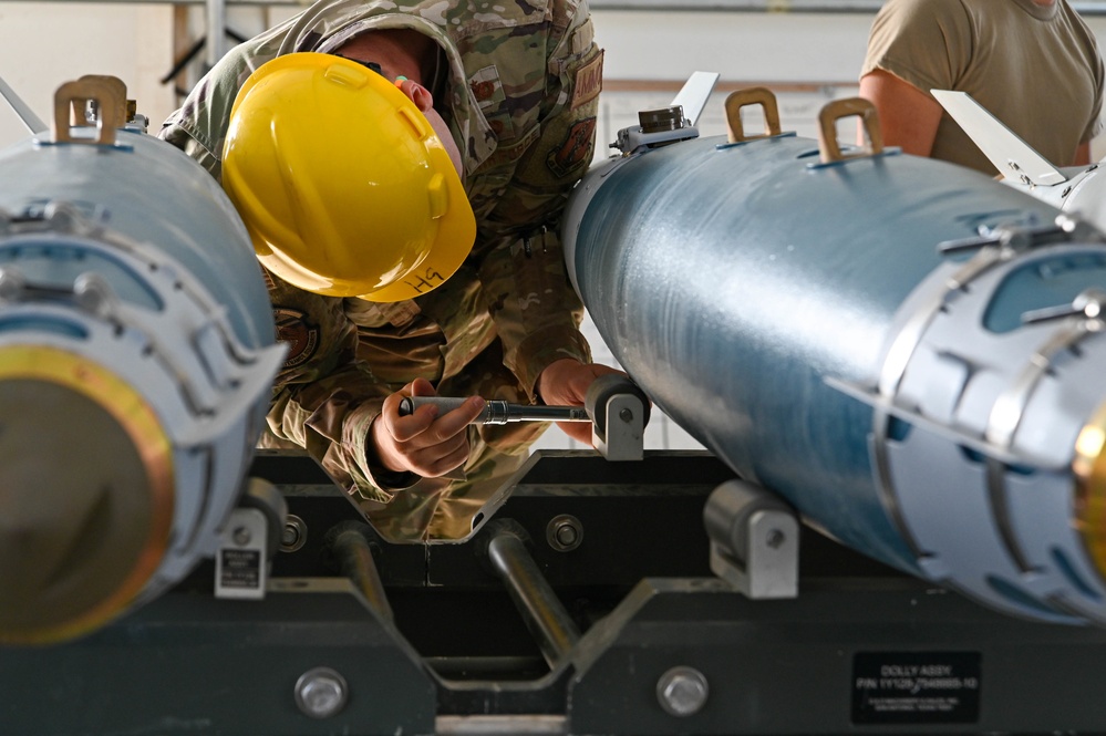 113th AMXS train by building GBU-38s