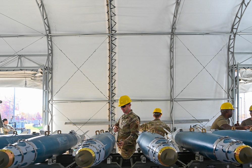 113th AMXS train by building GBU-38s