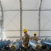 113th AMXS train by building GBU-38s