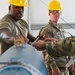 113th AMXS train by building GBU-38s