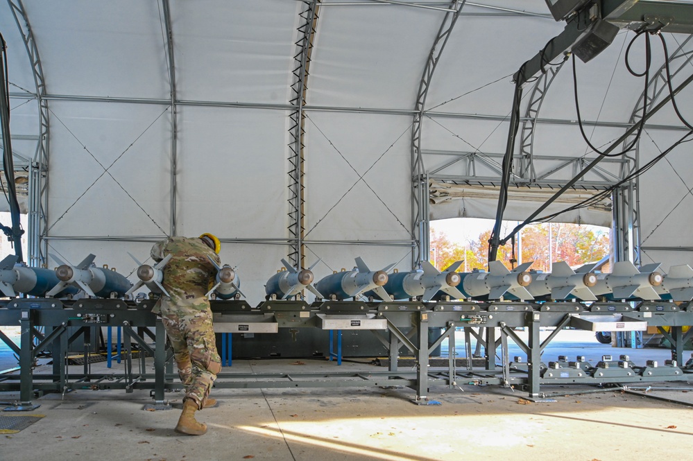 113th AMXS train by building GBU-38s