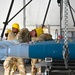113th AMXS train by building GBU-38s