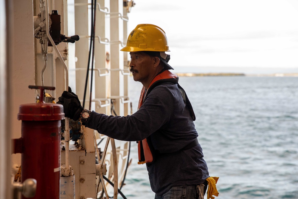 Civilian mariners assigned to the USNS Comfort, assist with a port departure during Continuing Promise 2022