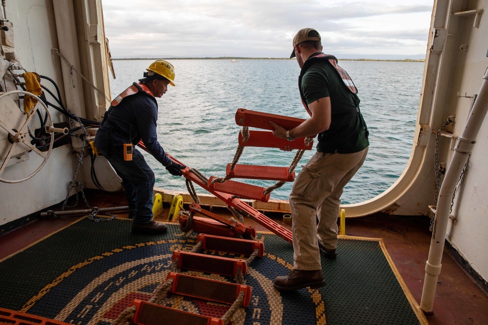 Civilian mariners assigned to the USNS Comfort, assist with a port departure during Continuing Promise 2022