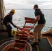 Civilian mariners assigned to the USNS Comfort, assist with a port departure during Continuing Promise 2022