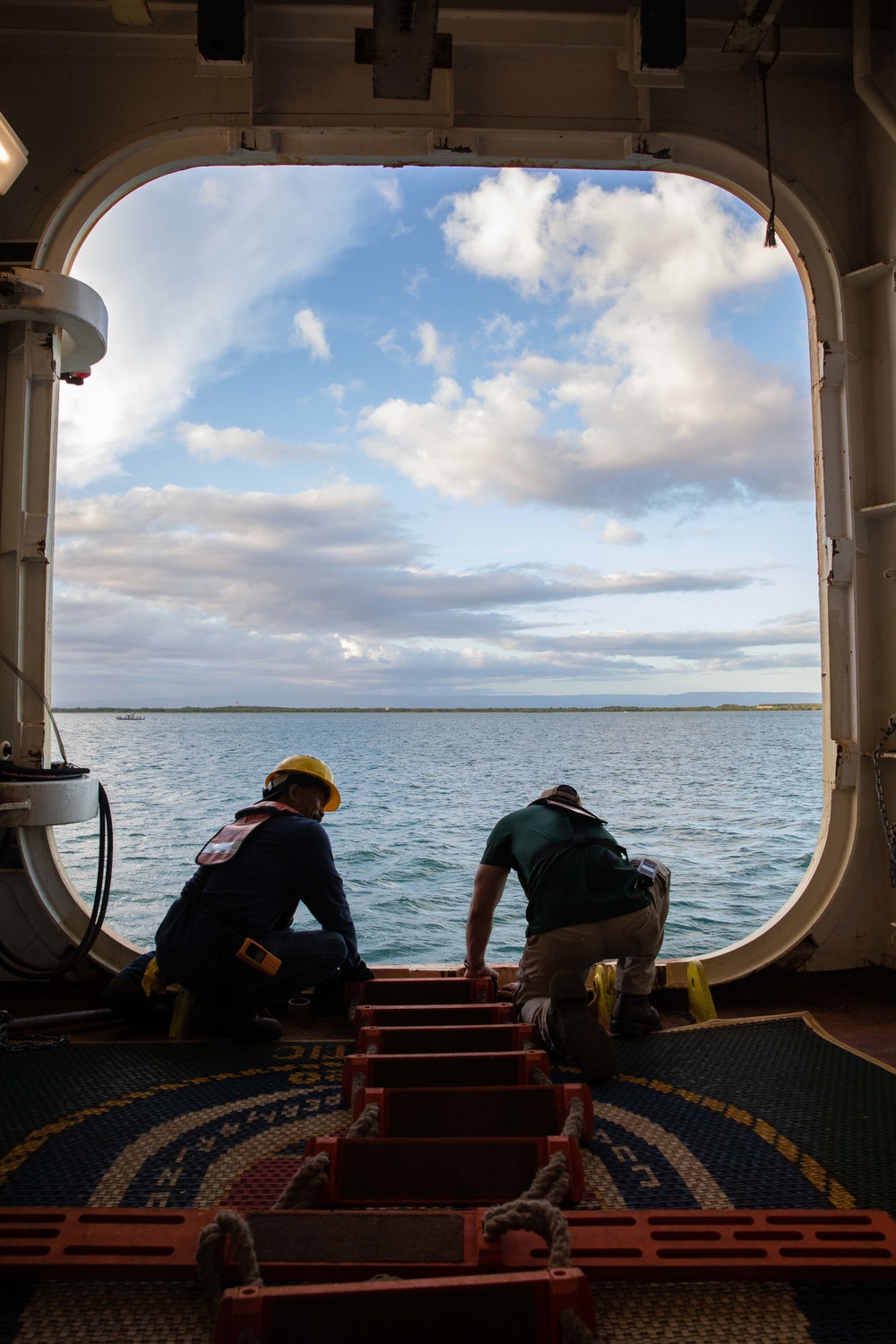 Civilian mariners assigned to the USNS Comfort, assist with a port departure during Continuing Promise 2022