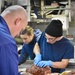 USCGC Hamilton personnel prepare a Thanksgiving feast for the crew while operating in the Baltic Sea