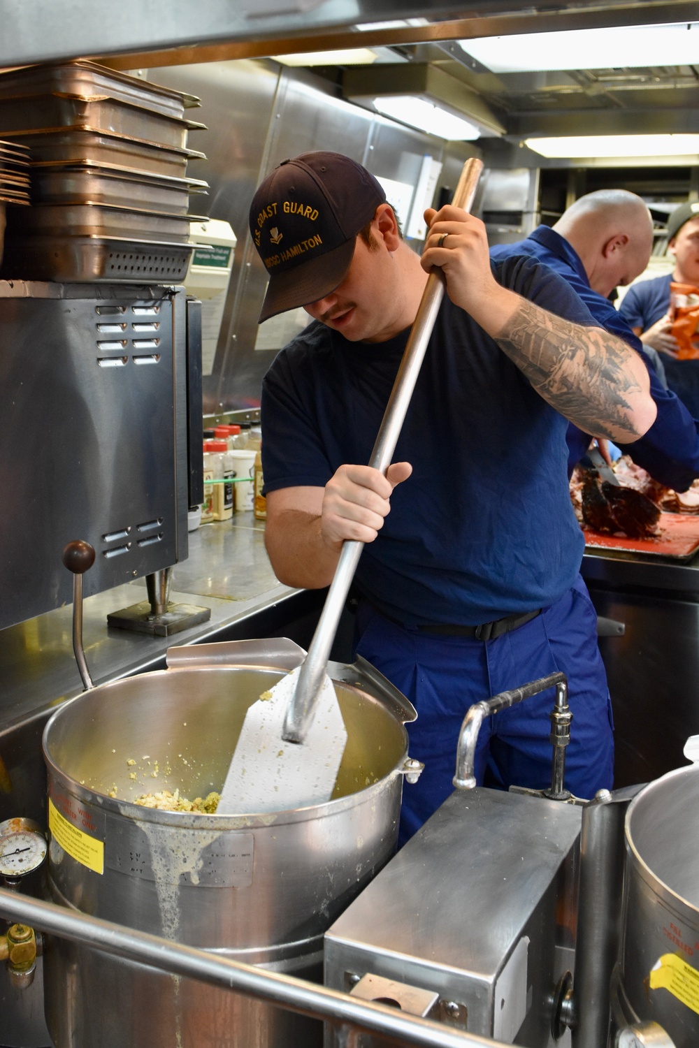 USCGC Hamilton personnel prepare a Thanksgiving feast for the crew while operating in the Baltic Sea