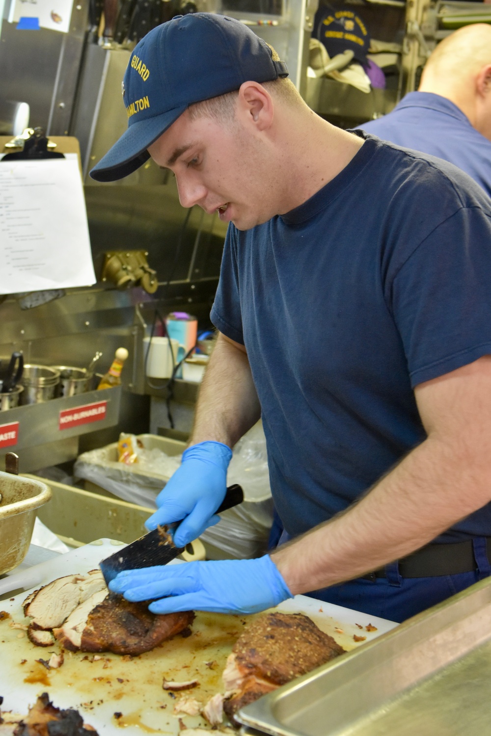 USCGC Hamilton personnel prepare a Thanksgiving feast for the crew while operating in the Baltic Sea