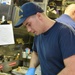 USCGC Hamilton personnel prepare a Thanksgiving feast for the crew while operating in the Baltic Sea