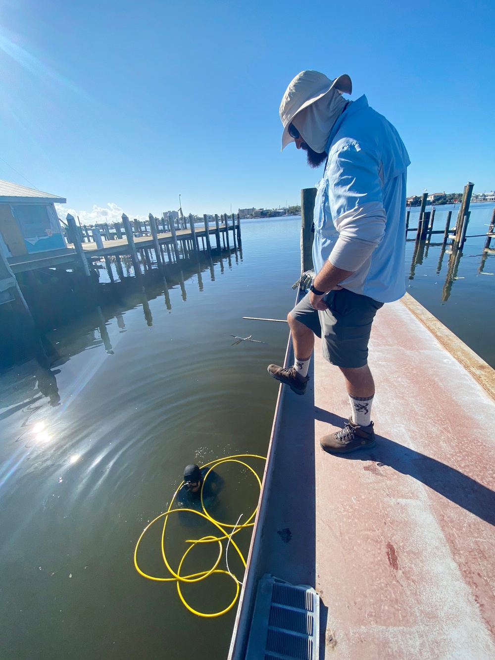 Crews Work to Check Safety of Pilings on Docks Damaged by Hurricane Ian