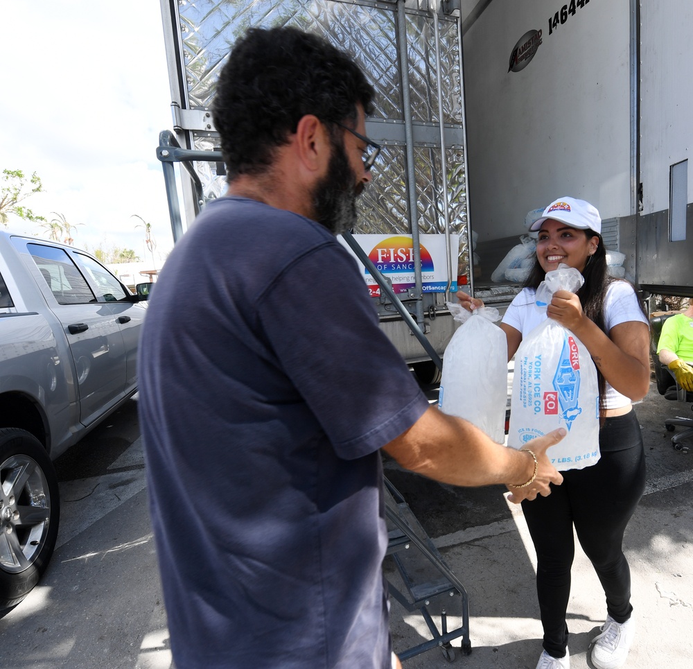 Volunteers Hand Out Ice