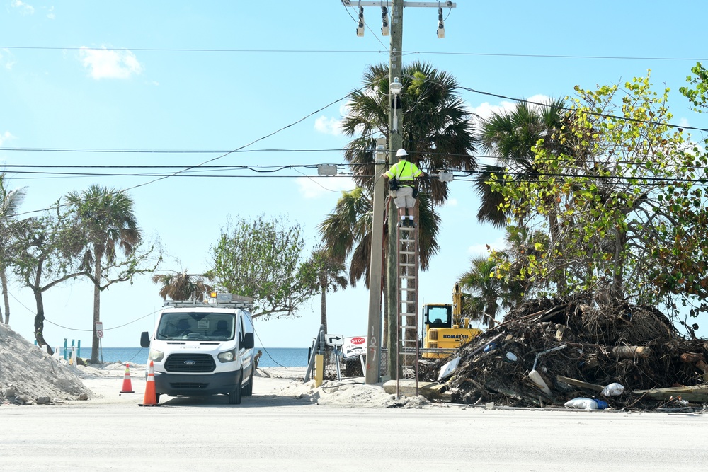 Crews Work To Connect Electricity