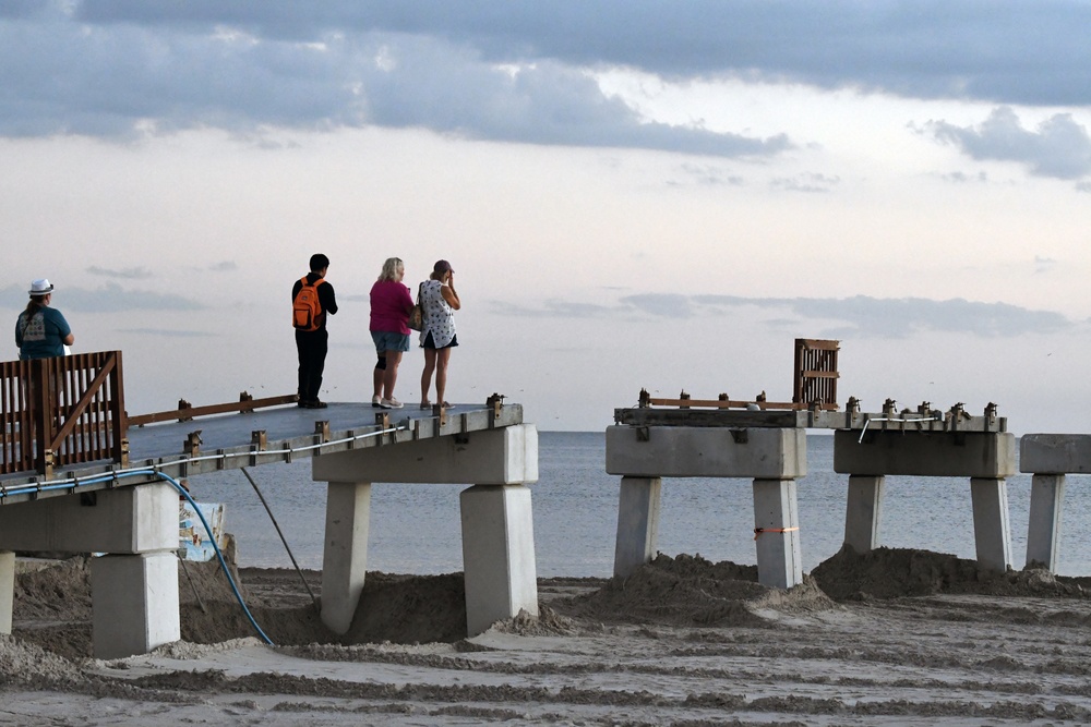 People Gather For a Vigil to Honor Hurricane Victims and Survivors