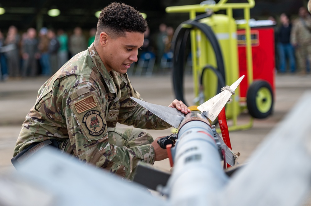 36th and 25th FGS compete in weapons load crew of the quarter competition