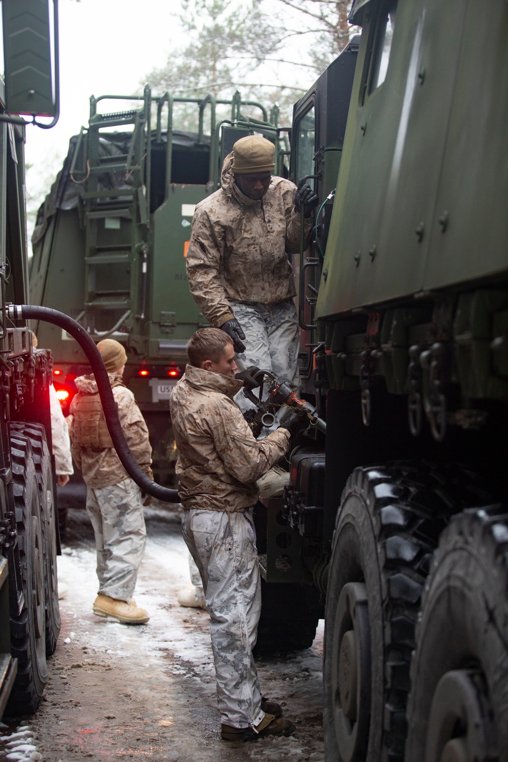 U.S. Marines with Combat Logistics Battalion 6 Conduct Motor Transport Convoy Refuel in Finland