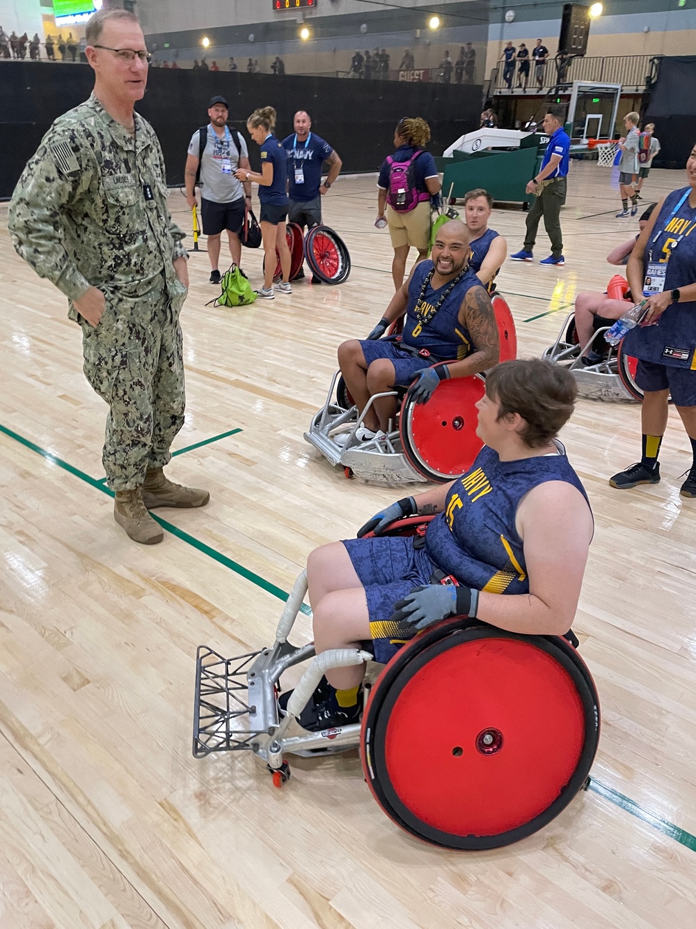 VADM Yancy Lindsey talks with Team Navy's wheelchair rugby players