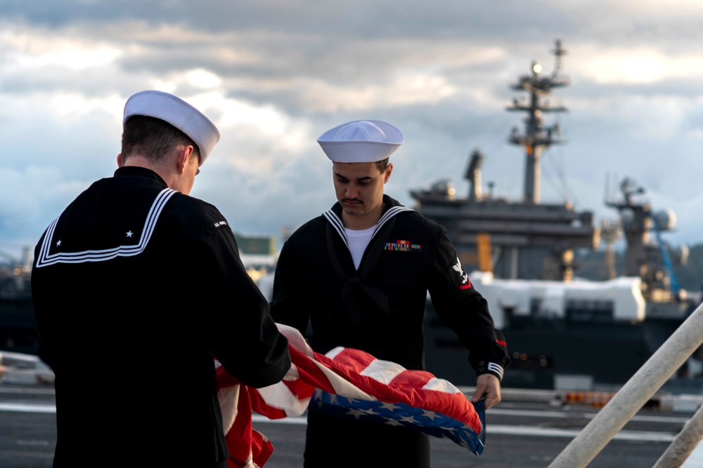 Sailors Fold Ensign