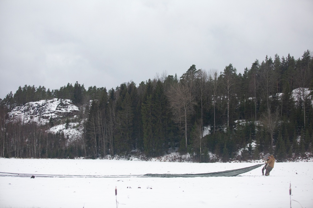 U.S. Marines with Combat Logistics 6 Conduct an Aerial Delivery with Finnish KASA 295 Aircraft