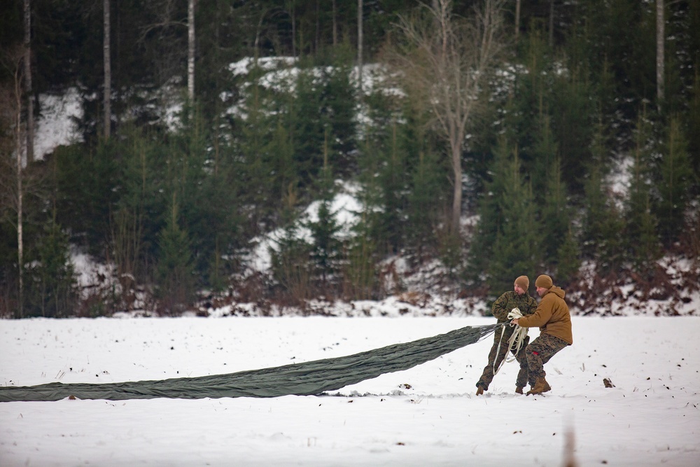 U.S. Marines with Combat Logistics 6 Conduct an Aerial Delivery with Finnish KASA 295 Aircraft