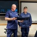 Capt. Darwin A. Jensen presents Chief Petty Officer Brian Wereda with the Coast Guard Commendation Medal
