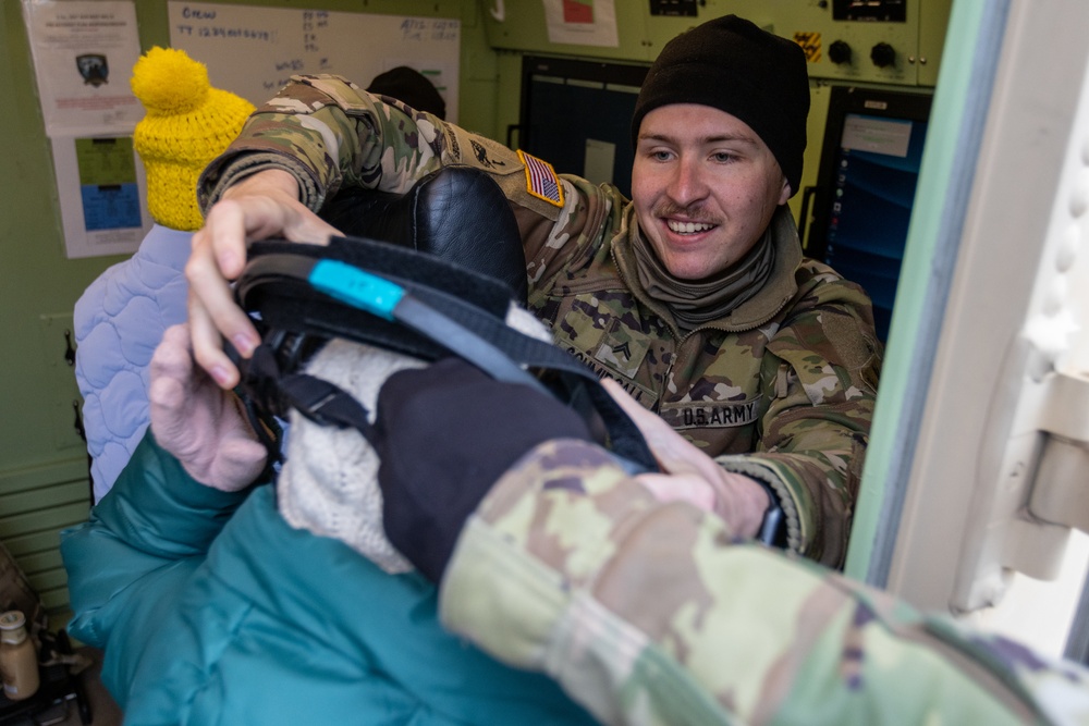 U.S. Army Soldier Teaches Polish Elementary schooler about military communicaton