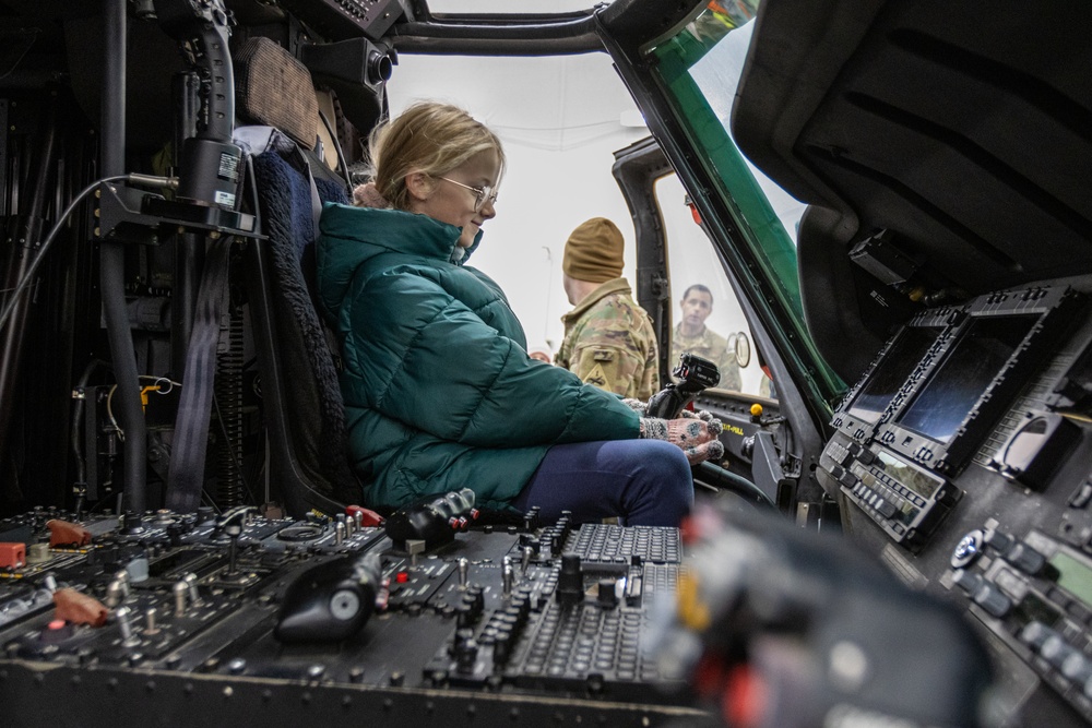 Polish Elementary School student sits inside of an UH-60 Blackhawk