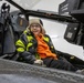 Polish Elementary School student sits inside of an AH-64 Apache