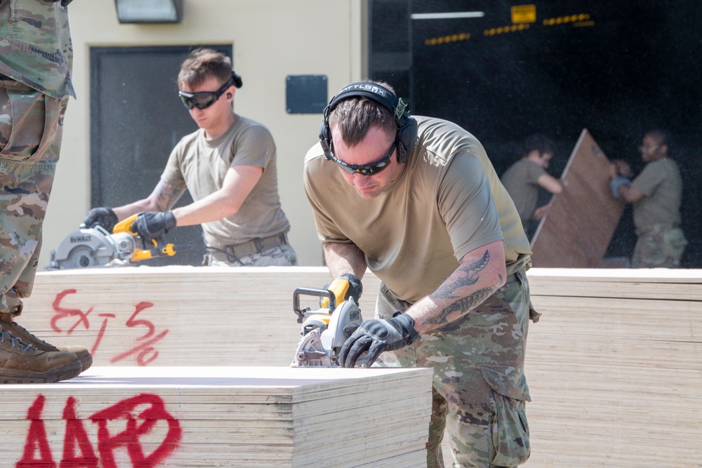 Yokota’s CFM Airmen prepare for bundle building during Operation Christmas Drop 2022