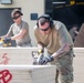 Yokota’s CFM Airmen prepare for bundle building during Operation Christmas Drop 2022