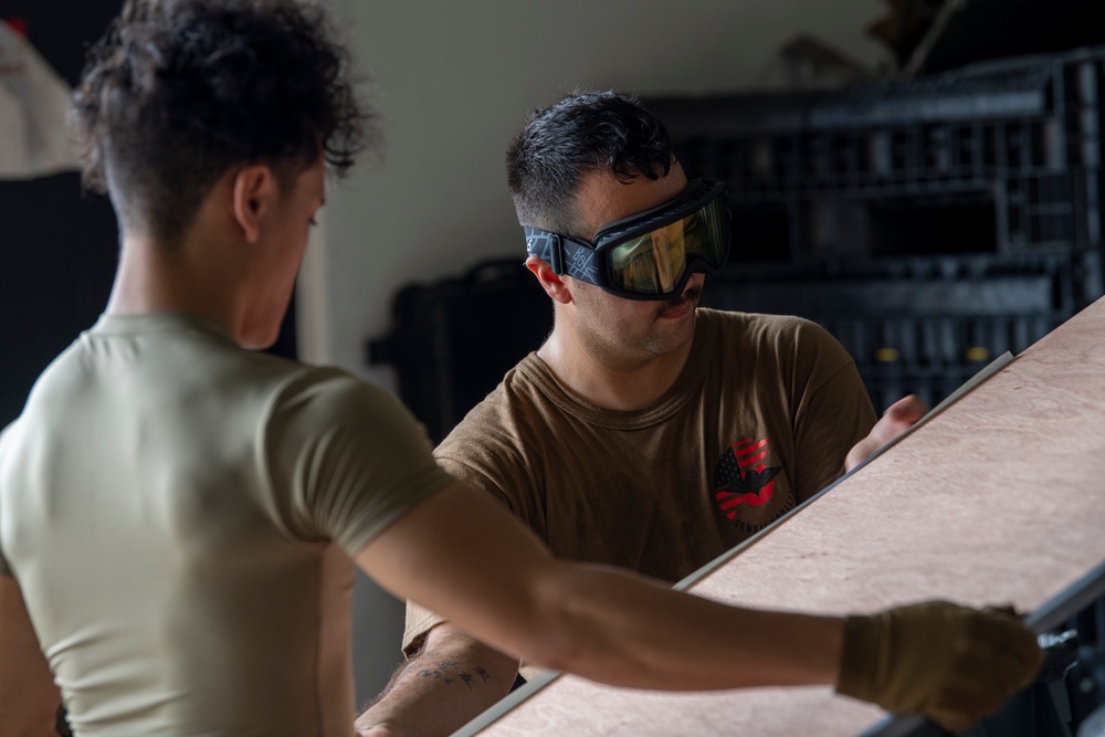 Yokota’s CFM Airmen prepare for bundle building during Operation Christmas Drop 2022