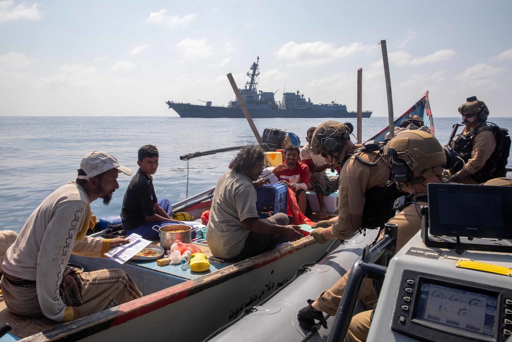 Nitze Sailors give supplies to civilian fishermen