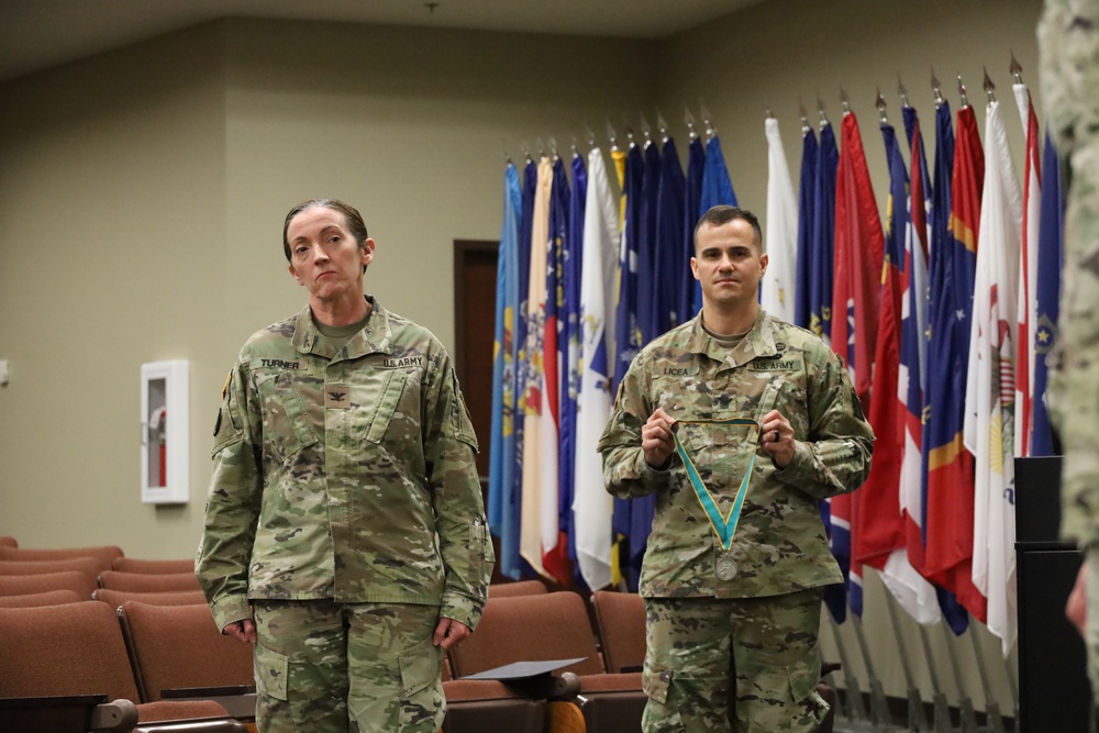 Col. Kathleen Turner and Sgt. Maj. Alejandro Licea Prepare to Present the Order of Saint Gabriel Medallion