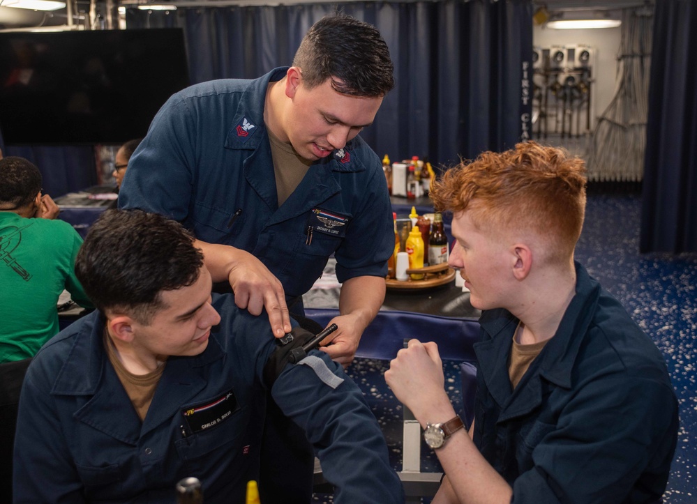 USS Ronald Reagan (CVN 76) Sailors conduct Tactical Combat Casualty Care training