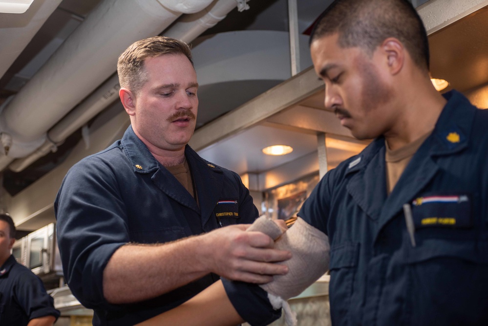 USS Ronald Reagan (CVN 76) Sailors conduct Tactical Combat Casualty Care training