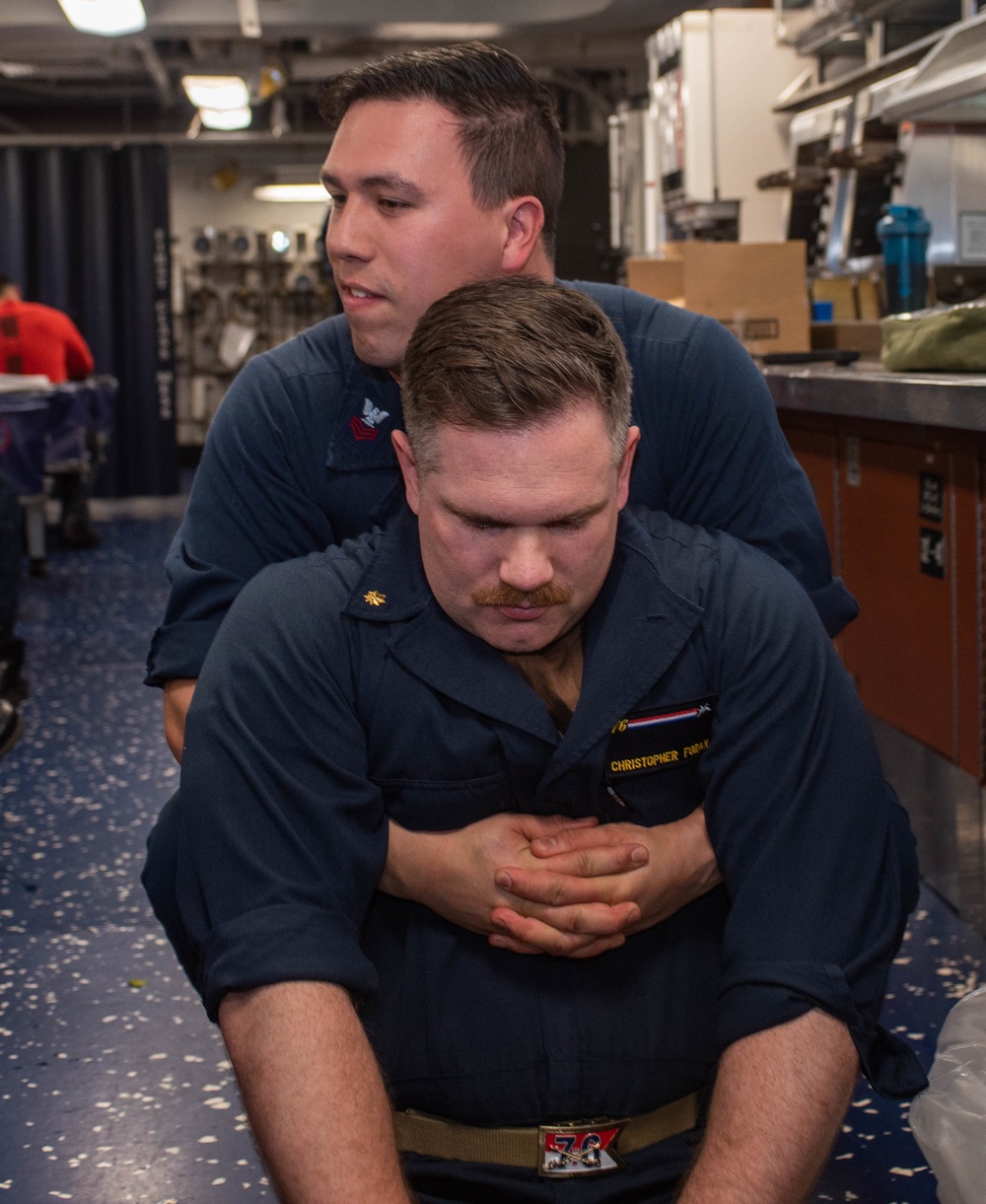 : USS Ronald Reagan (CVN 76) Sailors conduct Tactical Combat Casualty Care training