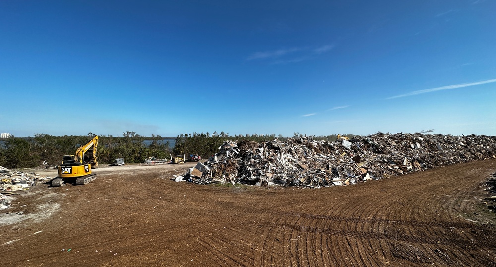 Crews Continue Work At Debris Collection Sites